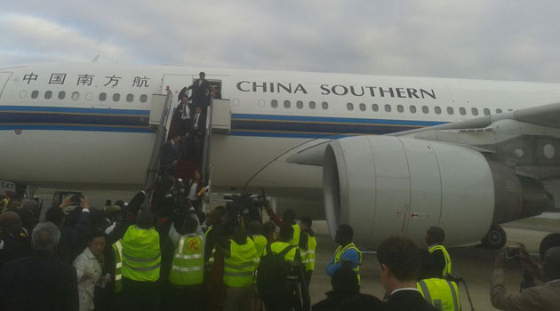 China Southern Airlines Chairman Si Xianmin (C) is welcomed by Kenyans upon his arrival at Jomo Kenyatta International Airport (JKIA) in Nairobi, Kenya.