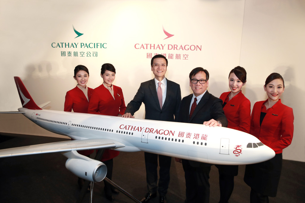 Cathay Pacific chief executive Ivan Chu (third from left) and Dragonair chief executive officer Algernon Yau (fourth from left) unveiled the new Cathay Dragon livery.