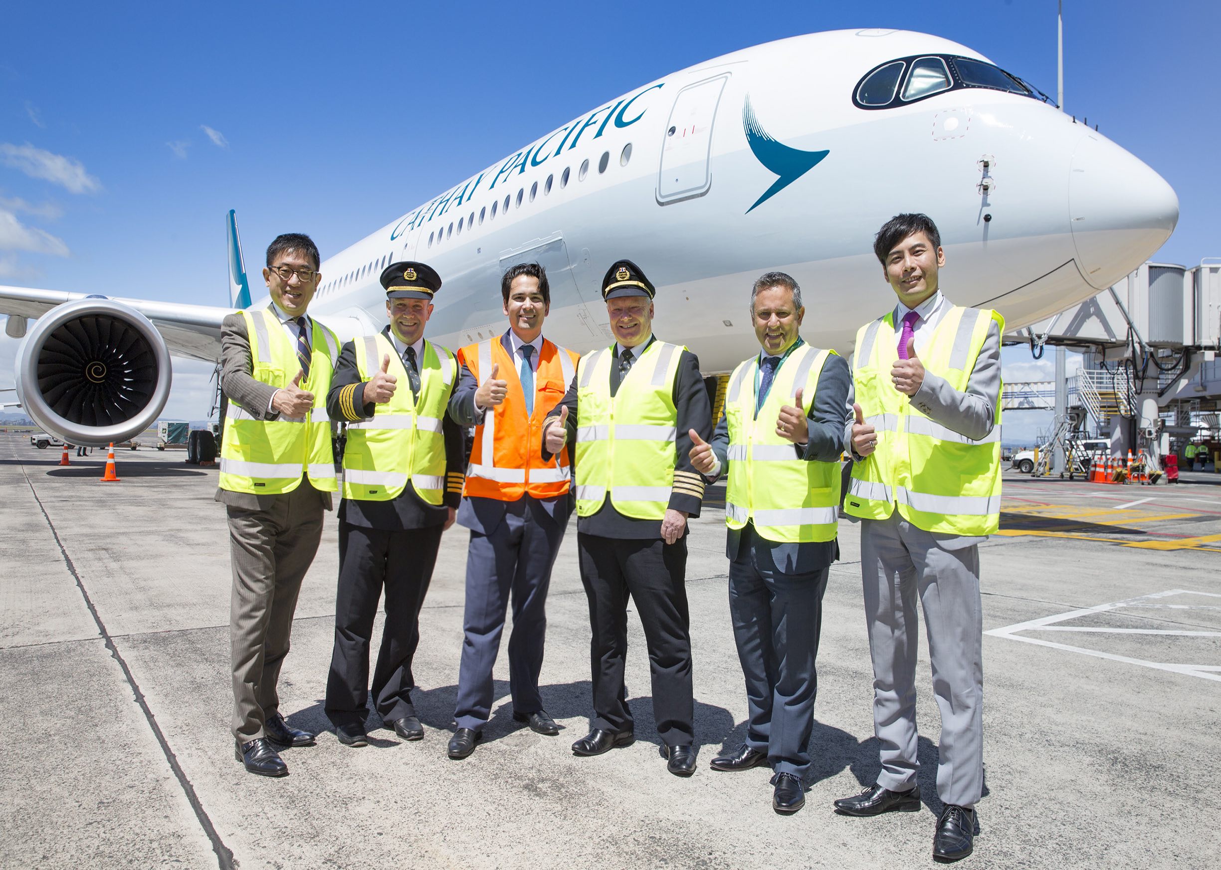 cap: New Zealand’s Minister of Transport, the Honourable Simon Bridges (third from left), welcomes the first A350 aircraft to Auckland with (from left) Cathay Pacific director sales & marketing Dane Cheng, chief pilot Airbus Gavin Haslemore, senior captain Colin Davis, country manager, New Zealand & Pacific Islands Mark Pirihi and general manager Southwest Pacific Nelson Chin.